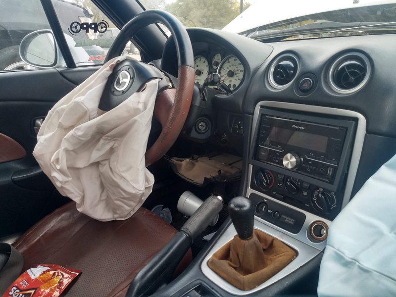 The radio flew out of its mounting due to the force of the crash